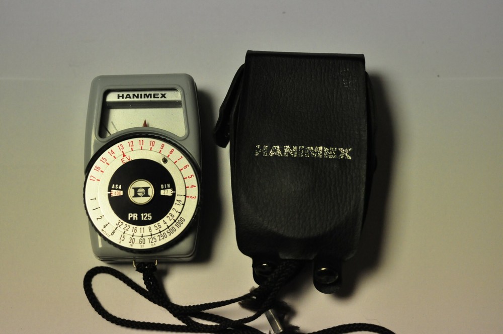 Hanimex model PR 125 light meter with strap and case.