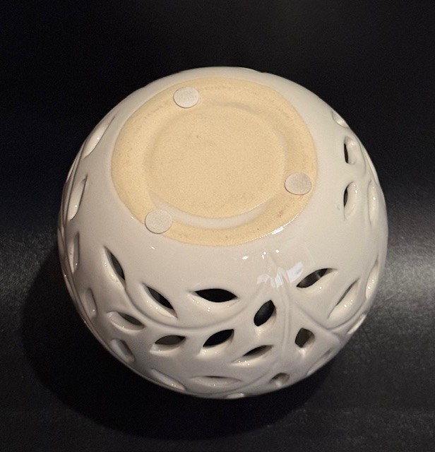 Decorative Round Candle or Tealight Holder with Leaves Design.