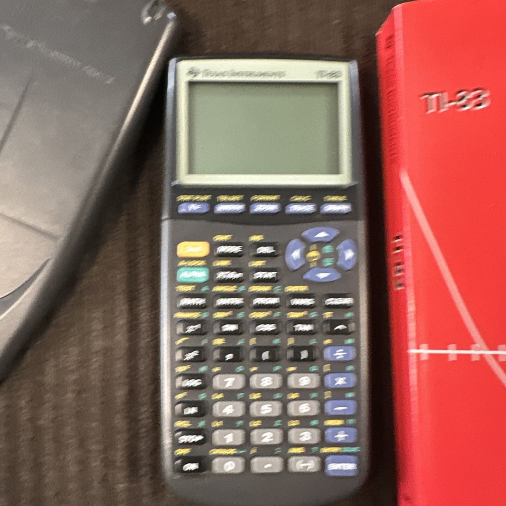Texas Instruments TI-83 Graphing Calculator + Cover & guidebook tested