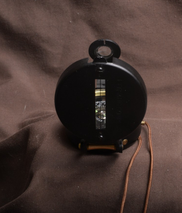 two lensatic compasses one with box