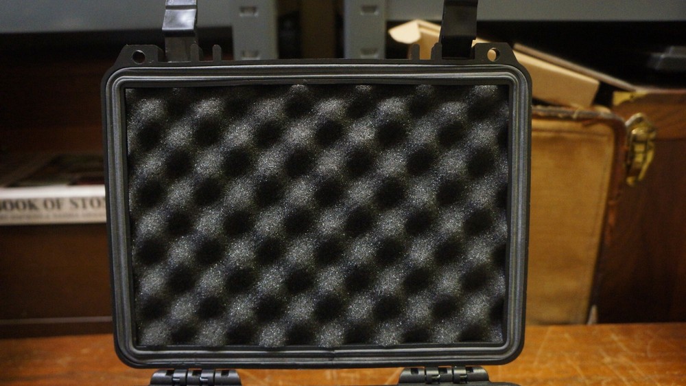 NICE BLACK HARD PLASTIC BOX WITH 20 GRADED COIN SLOTS--DOESNT LOCK TABS SECURE