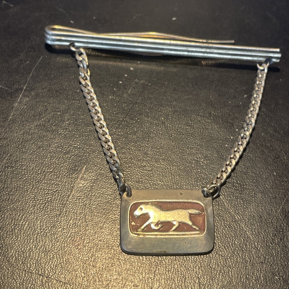 Silvertone clip with horse charm