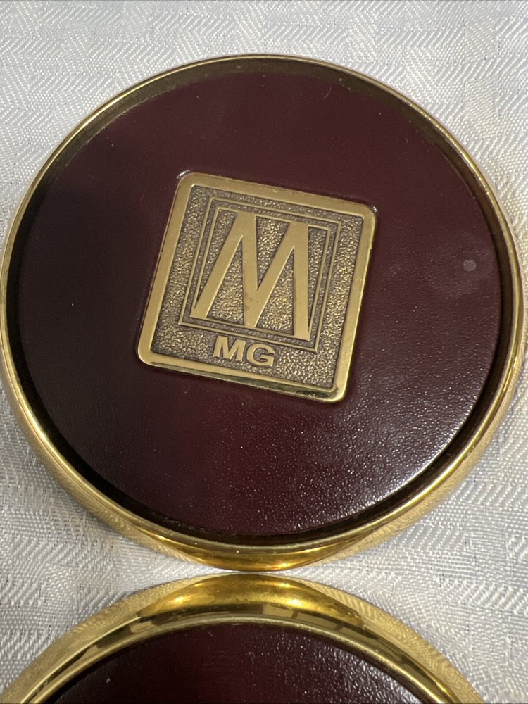 8 Vintage Solid BRASS and Brown LEATHER M MG COASTERS