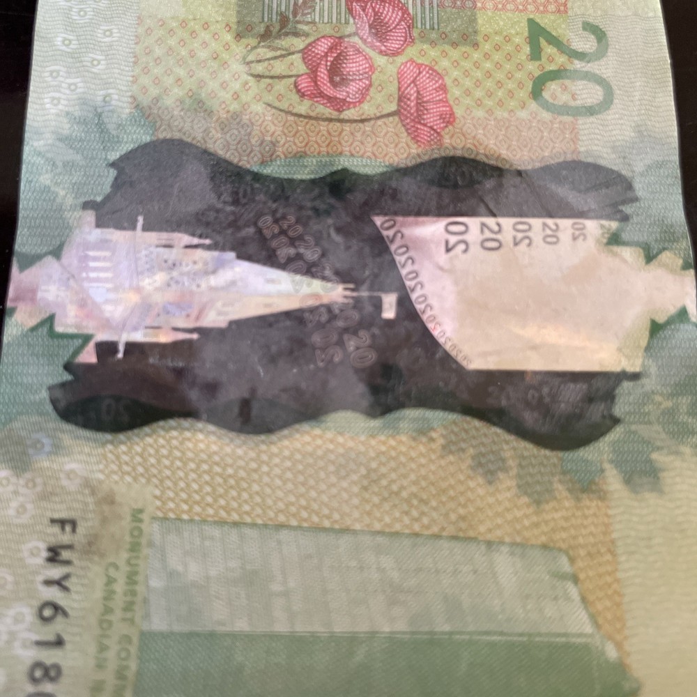 20 DOLLARS CANADA crisp with folds