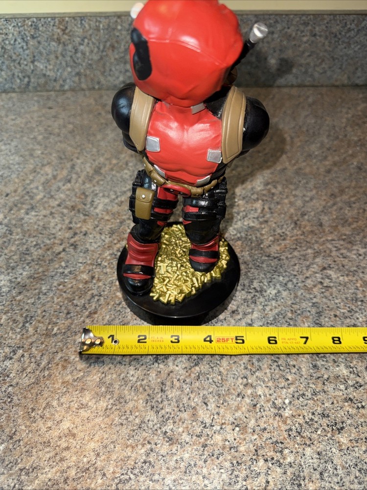 Deadpool controller/phone holder. Marvel Cableguys. Good shape. About 9 " High.