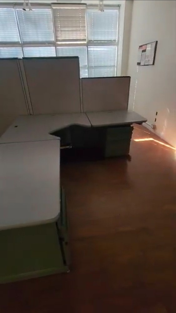 Eight used office cubicles and office desk.