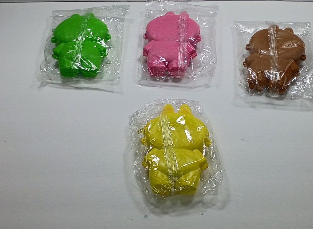 Small Laboboo Character purse with strap. rubber purse