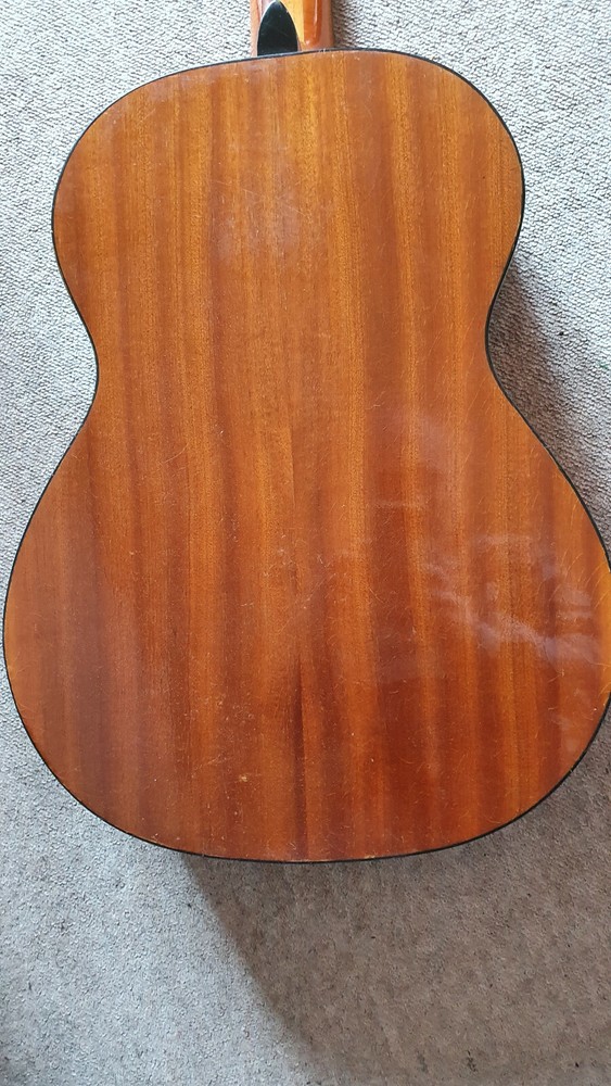 Old guitar with a nicely flamed back, needs service