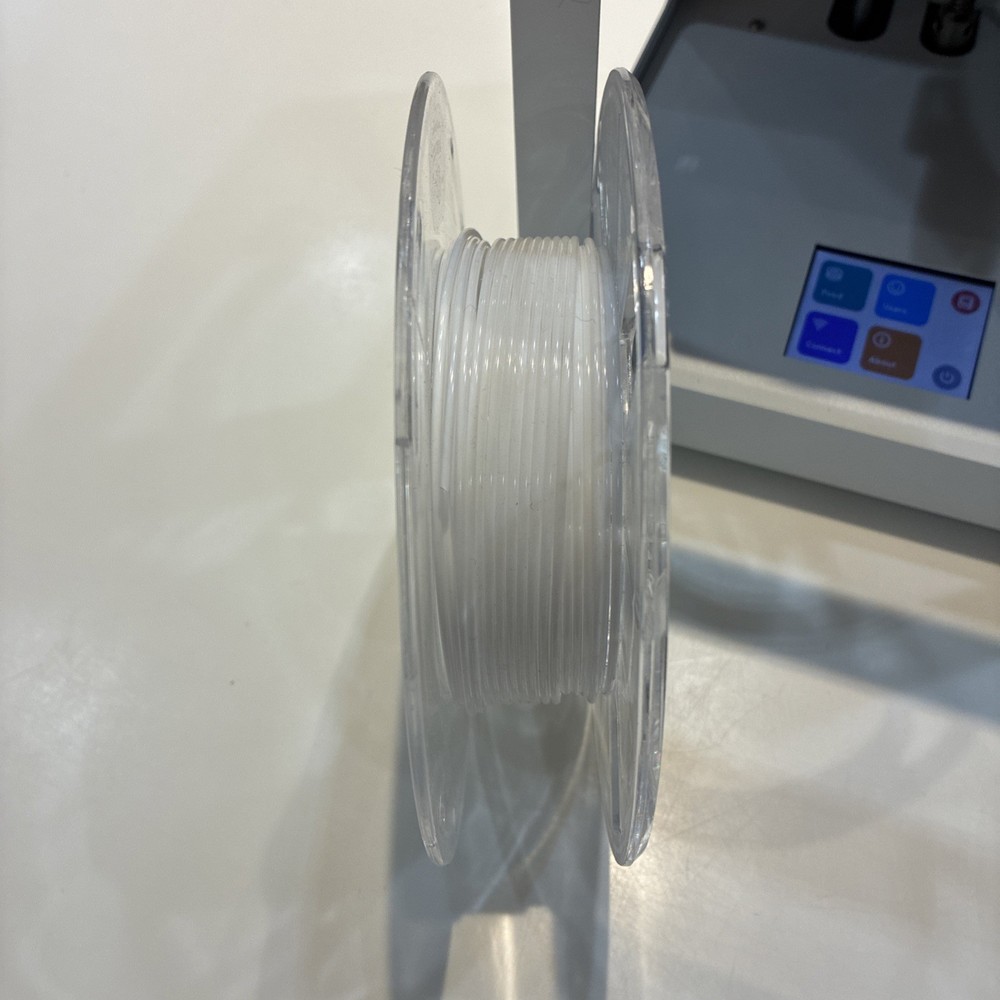 TOYBOX 3D Printer with white printer food.