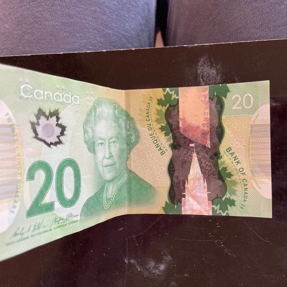 20 DOLLARS CANADA  crisp with folds