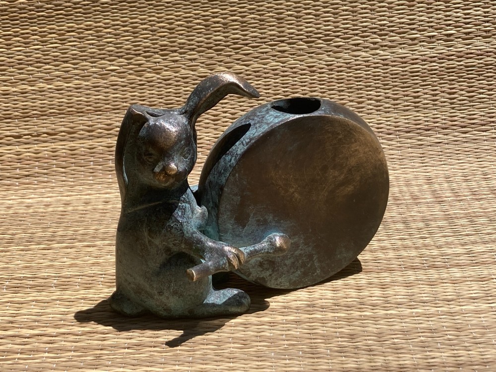 Bunny Vase drumming on a drum