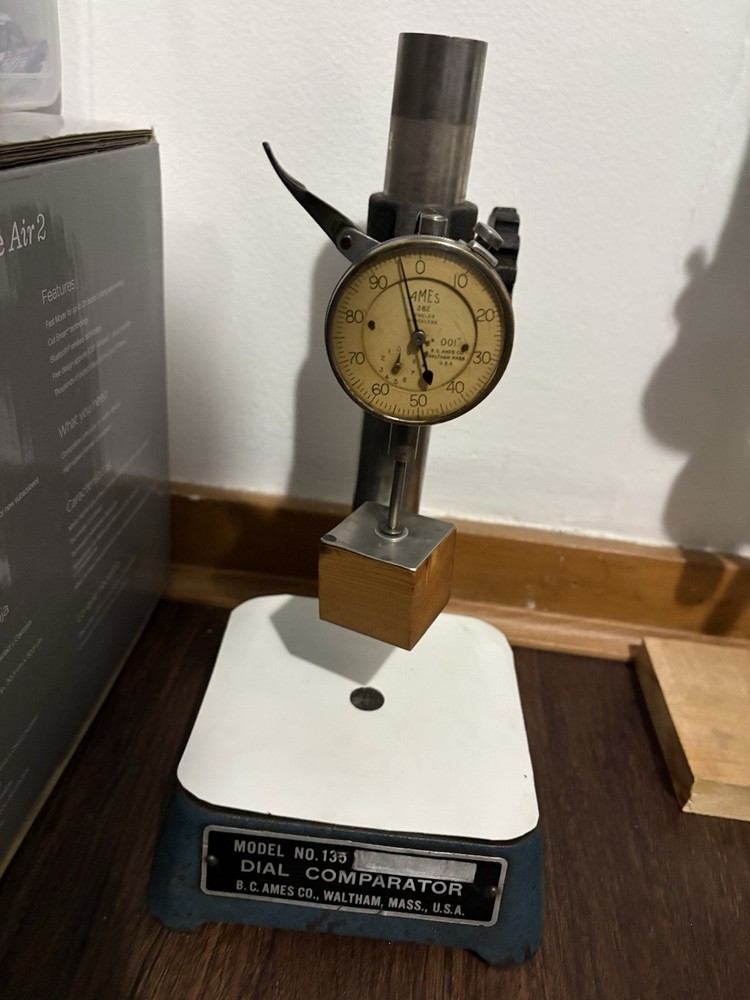 This is a vintage B.C. Ames Model No. 135 dial comparator.
