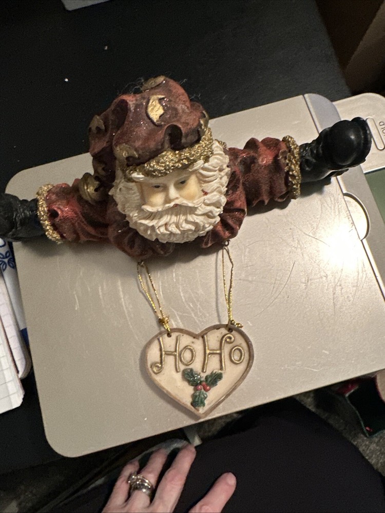 Santa Claus Doing Splits, With Dangling Heart Decor