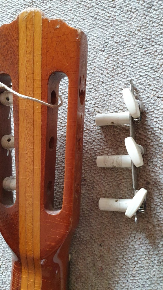 Old guitar with a nicely flamed back, needs service