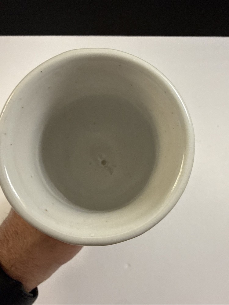 Handmade studio pottery drinking horn with a looped handle.