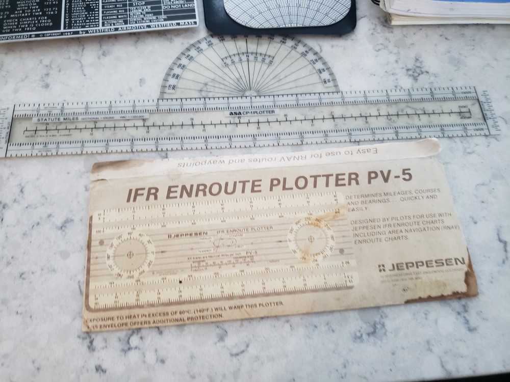 Sporty’s E6B electronic flight computer and Aviation slide computers plates