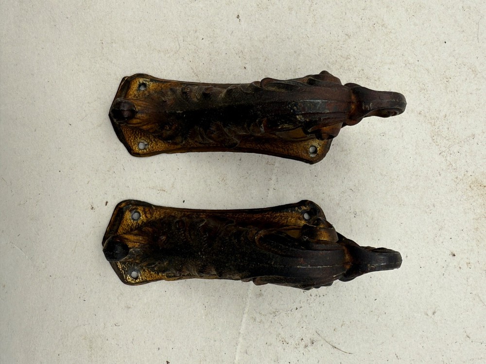 2 Antique Cast Ornaments From a Ingraham Clock. (CM92-0975)