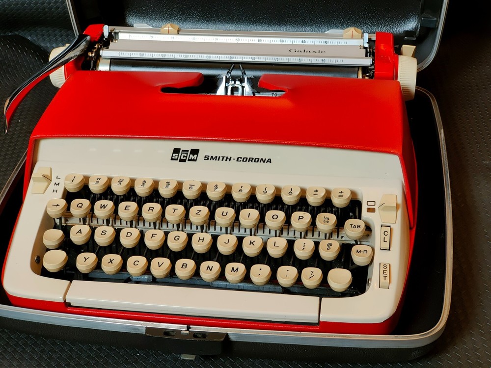 red, portable Smith Corona Galaxie typewriter with Cursive / Handwritten Script