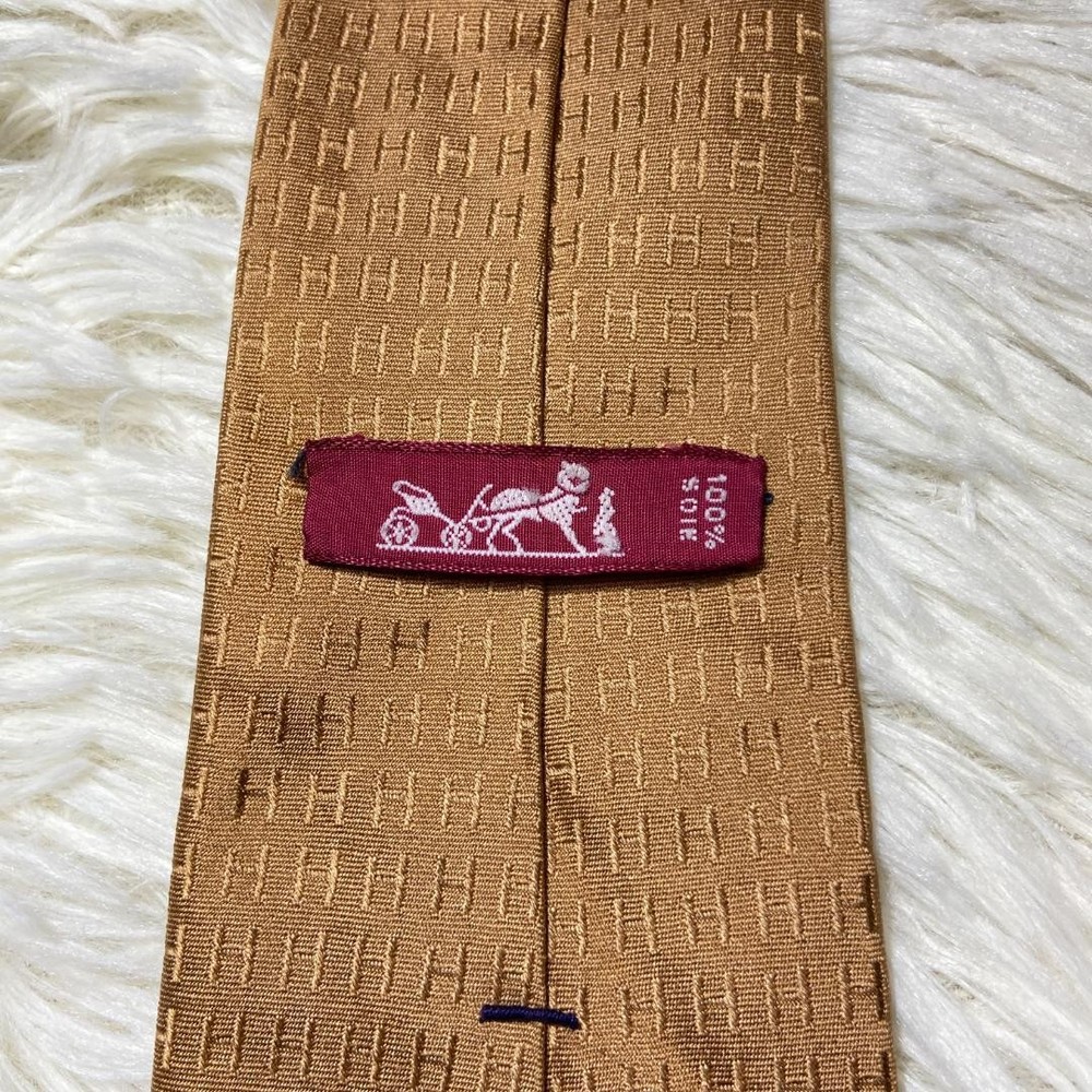 Fasone gold beige H pattern tie glossy