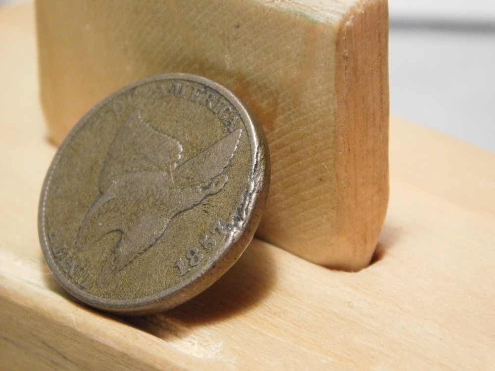 1857 U.S. Flying Eagle cent, lamination error at edge