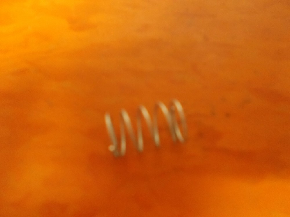 Paslode Part # 906336 SPRING, BUTTON (XP)