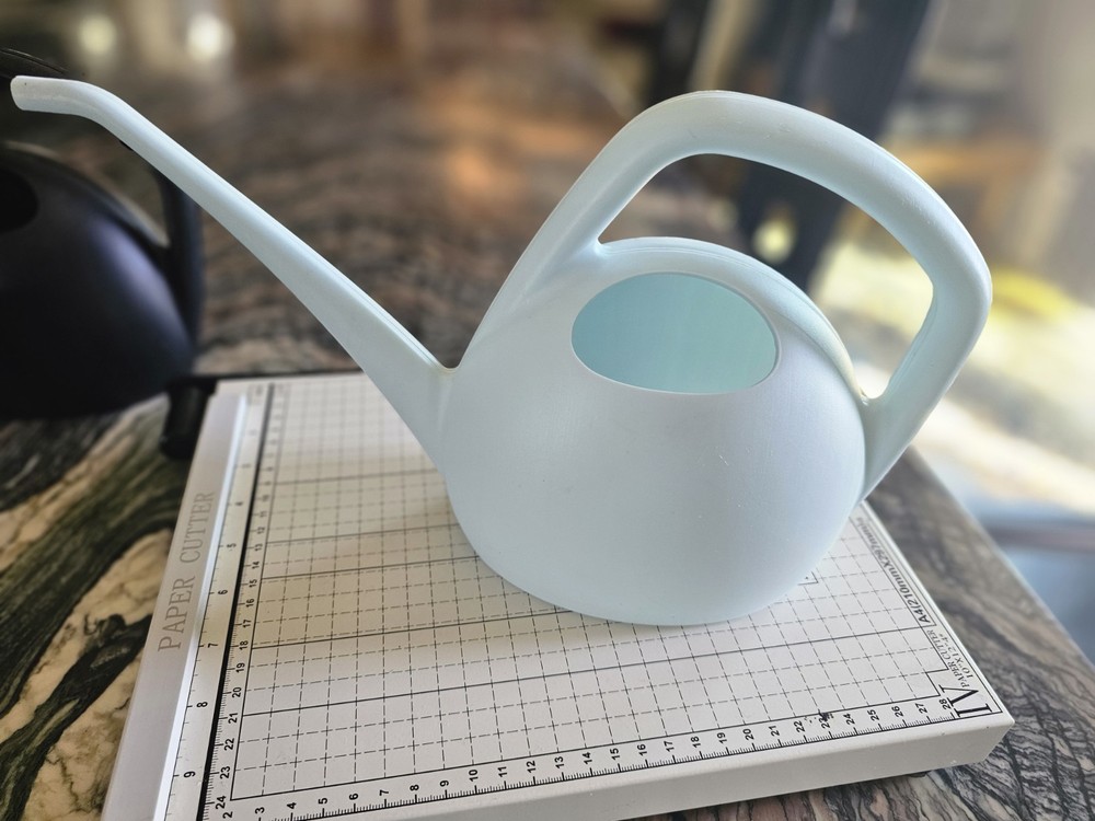 Watering can in blue or black