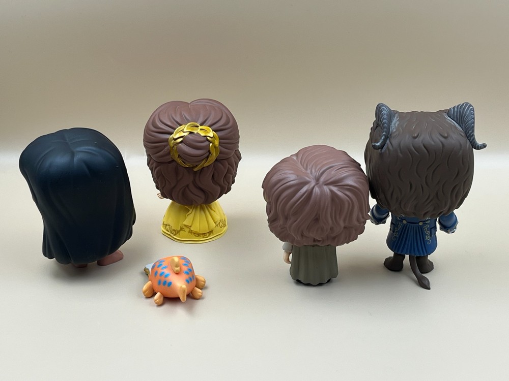 Four Funko Pop Vinyl Figures.