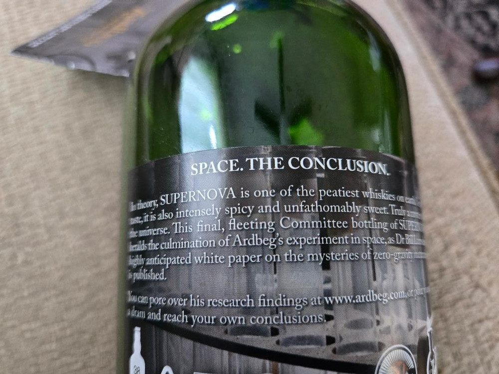 Ardbeg Supernova 2009 empty bottle and brochure