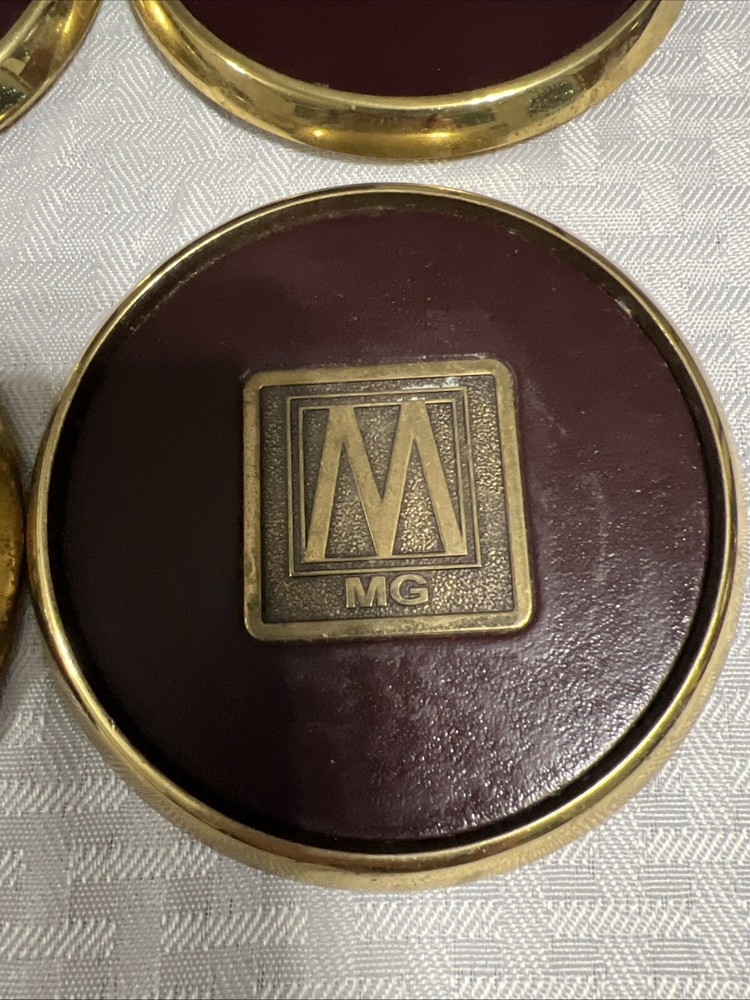8 Vintage Solid BRASS and Brown LEATHER M MG COASTERS