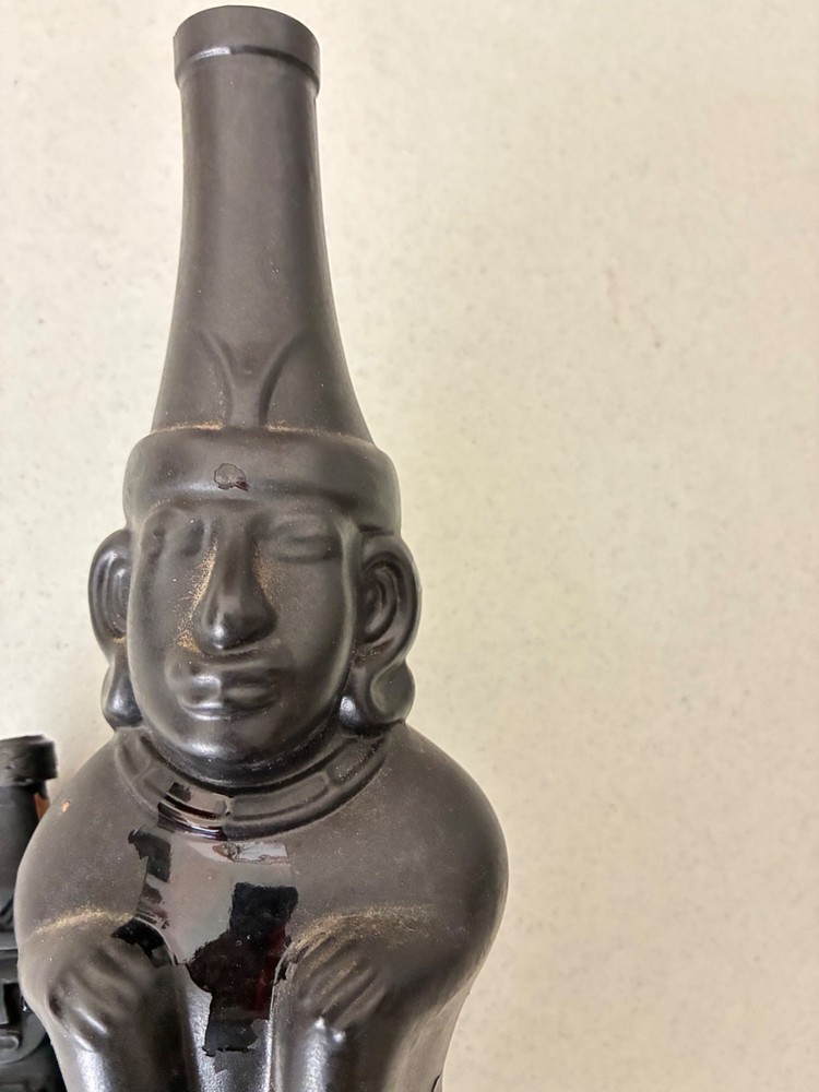 Two Empty Inca Pisco Bottles