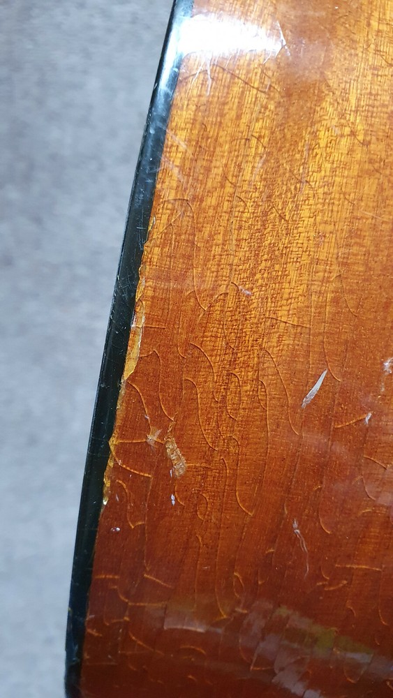 Old guitar with a nicely flamed back, needs service