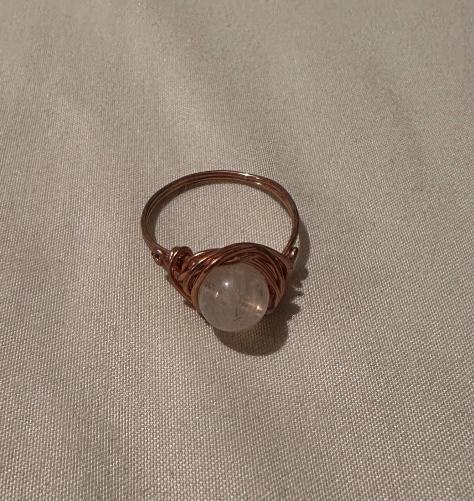 set of three rings, 2 gemstone, 1 wire, unknown specifics