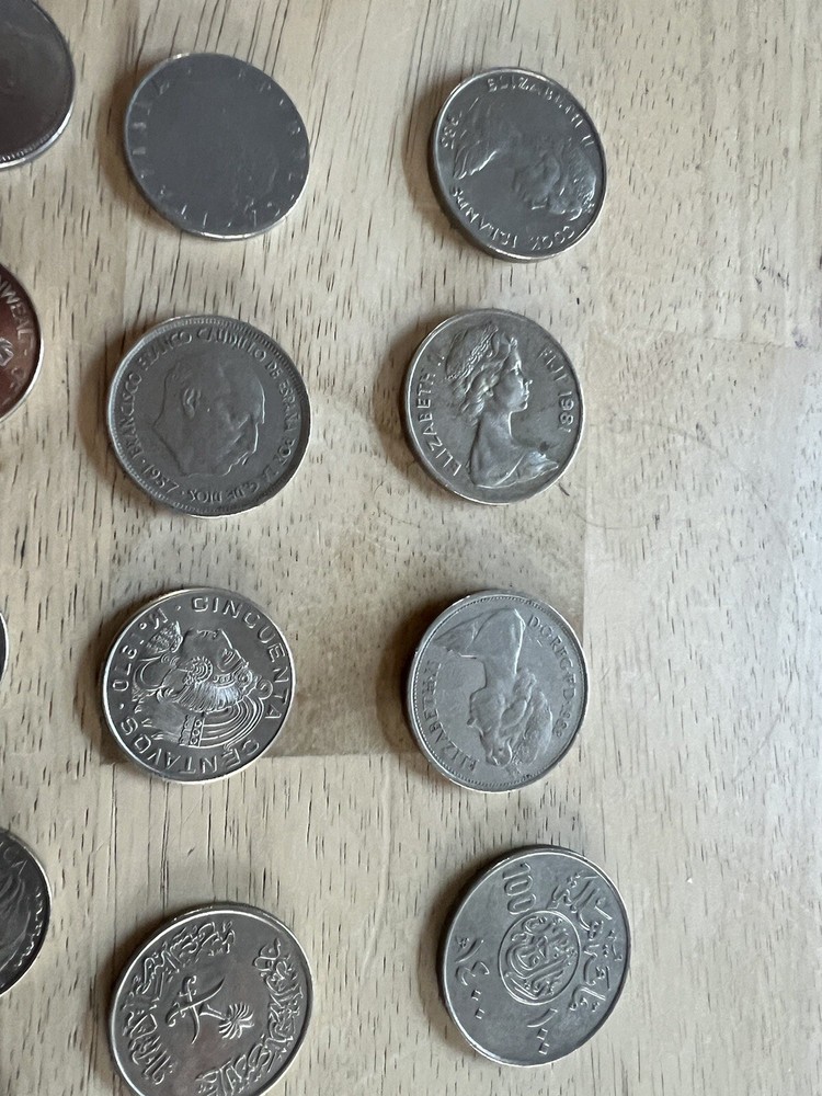 Assorted foreign coins. 26 Coins In Total