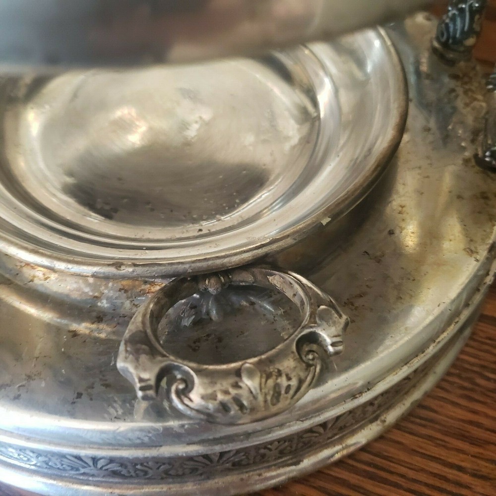 James W. Tuft silverplated tilting water pitcher. 20" tall. 