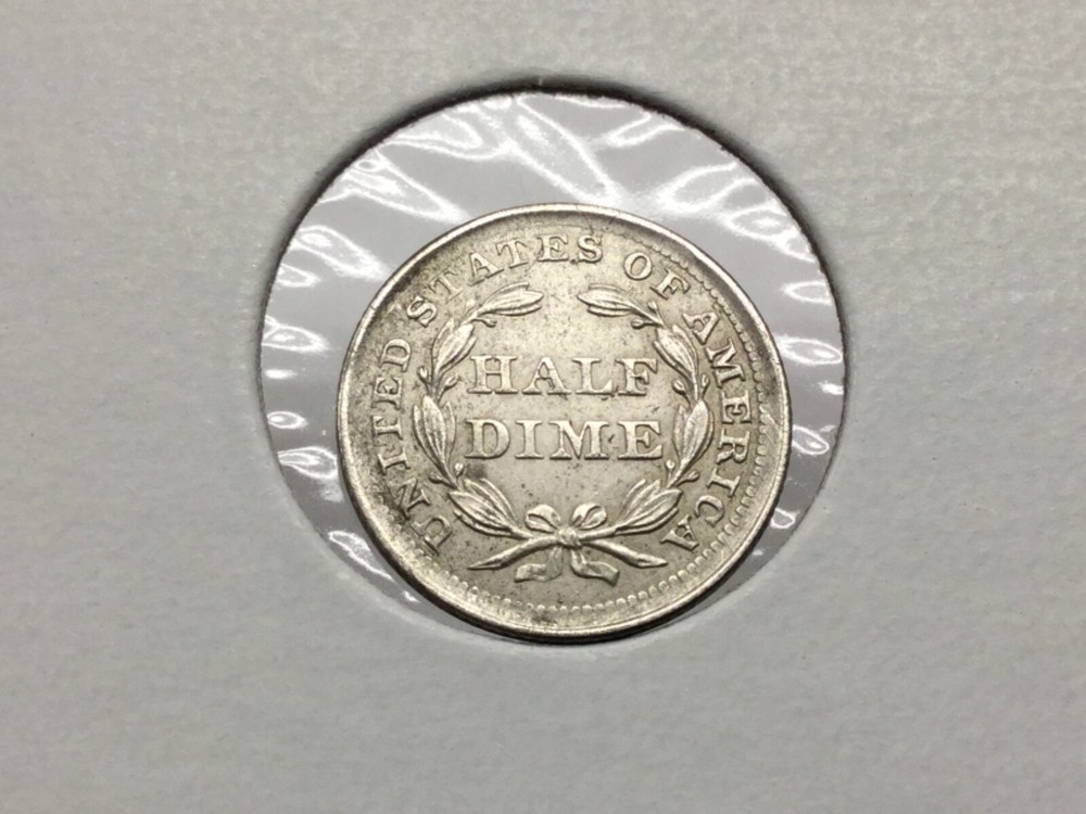 1857 Seated Half Dime in almost uncirculated