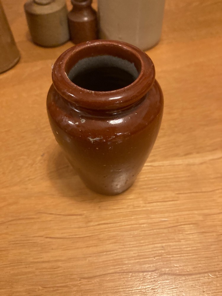 Vintage stone bottle collection in decent condition.
