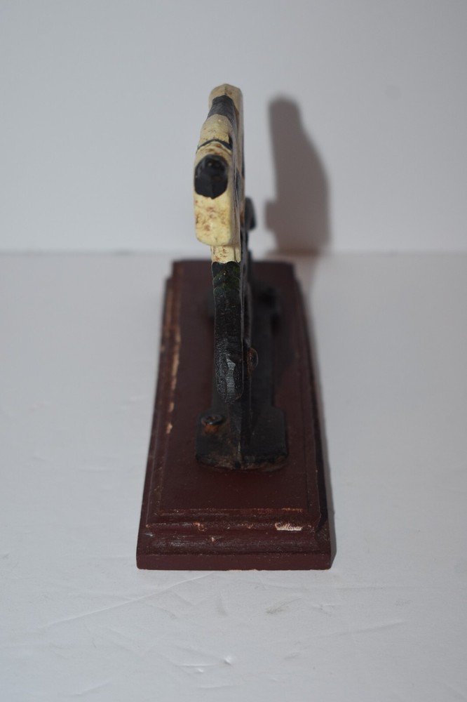 CAST IRON PAINTED COW NUTCRACKER / MOUNTED ON WOODEN BASE - BLACK & WHITE