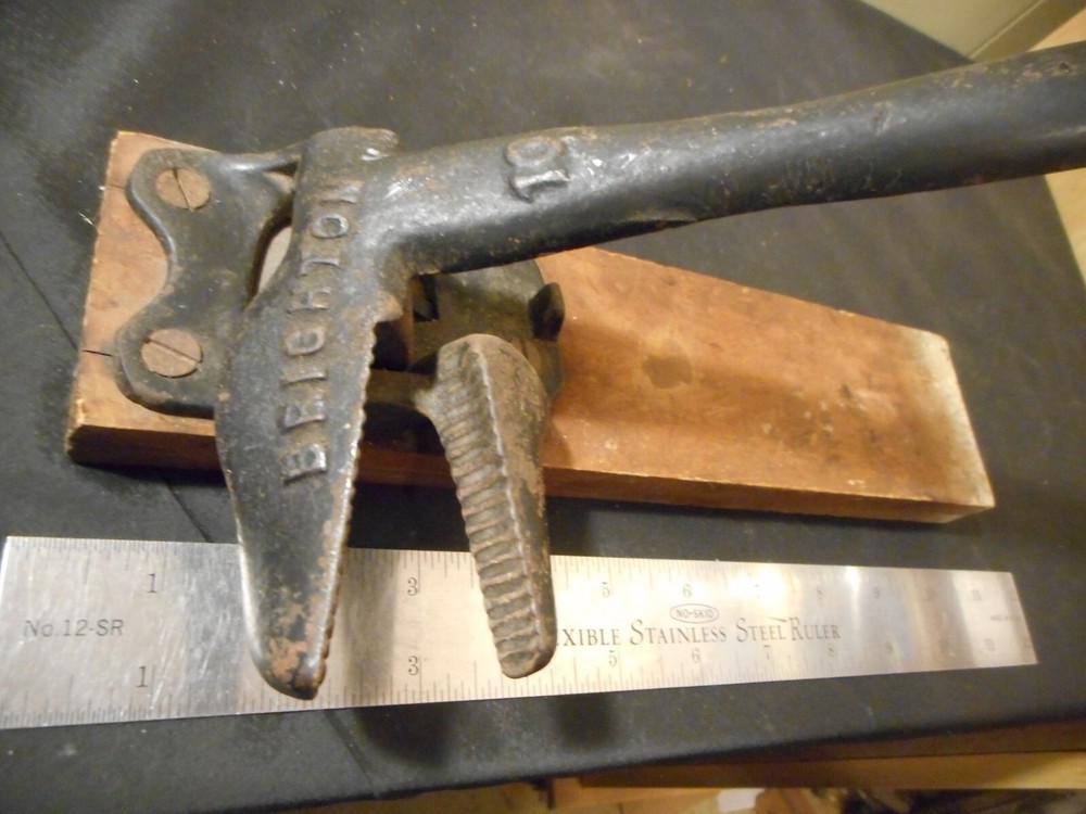 antique Brighton cast iron spring loaded nut cracker marked 10