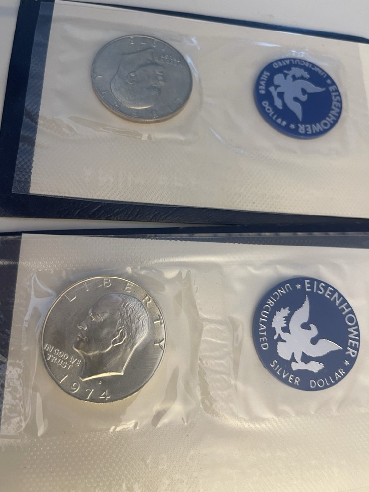 1972, 1973, 1974 Eisenhower 40% Silver Dollars Blue Envelopes, Uncirculated