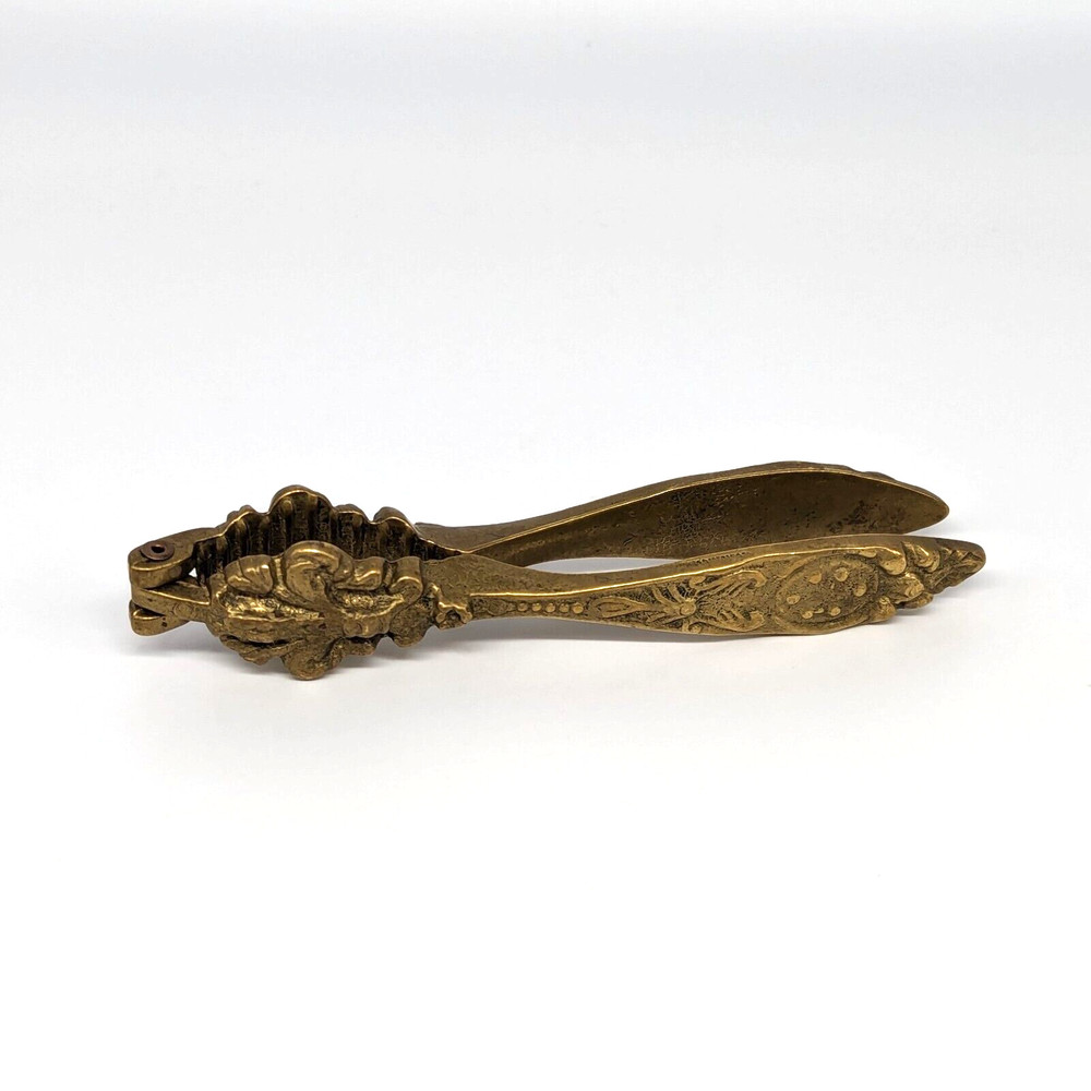 Brass Nutcracker Fleur de Lys Embossed Ornate Cast Floral Hollywood Regency