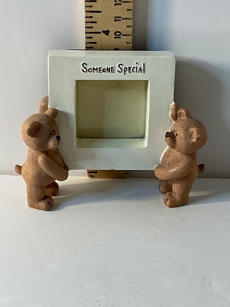 Two bears holding a picture frame "Someone special"