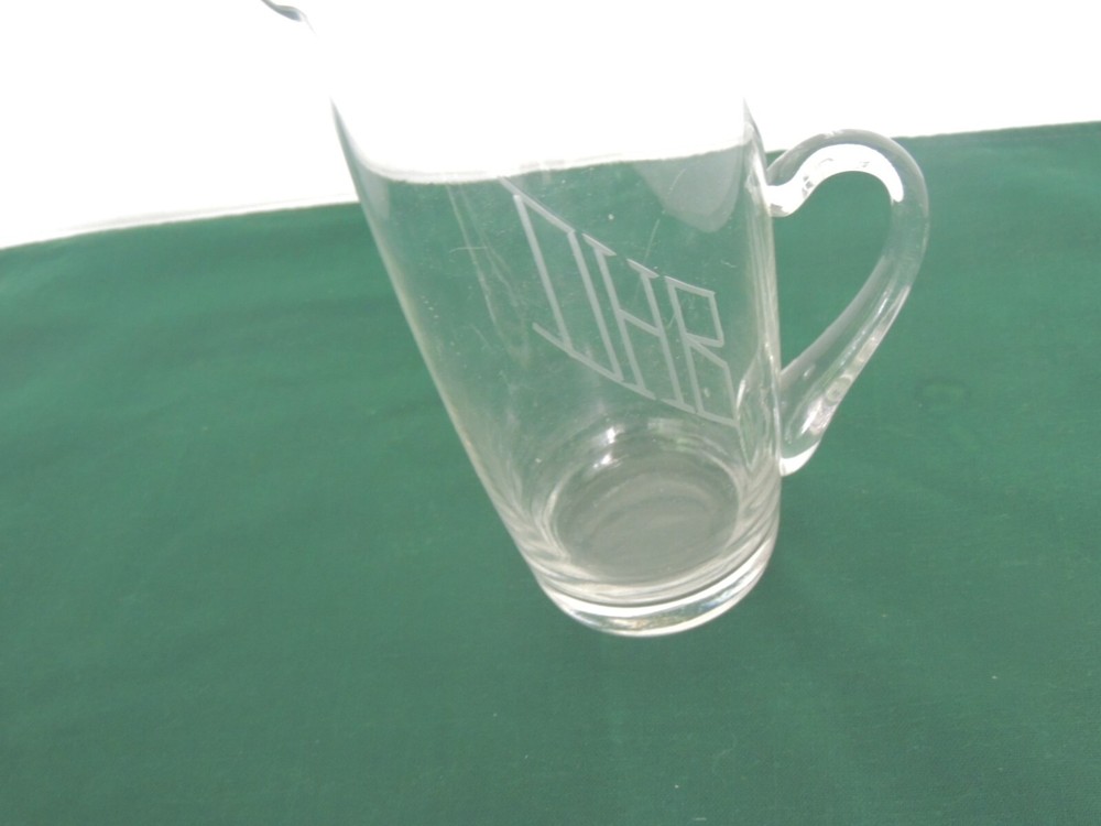 Vintage tall glass pitcher with initials AHB ? etched front clear 9" H D handle
