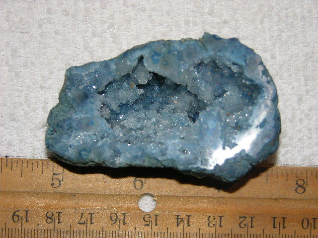 Geode cut & polished half with colored crystal center 2.5 inch E40
