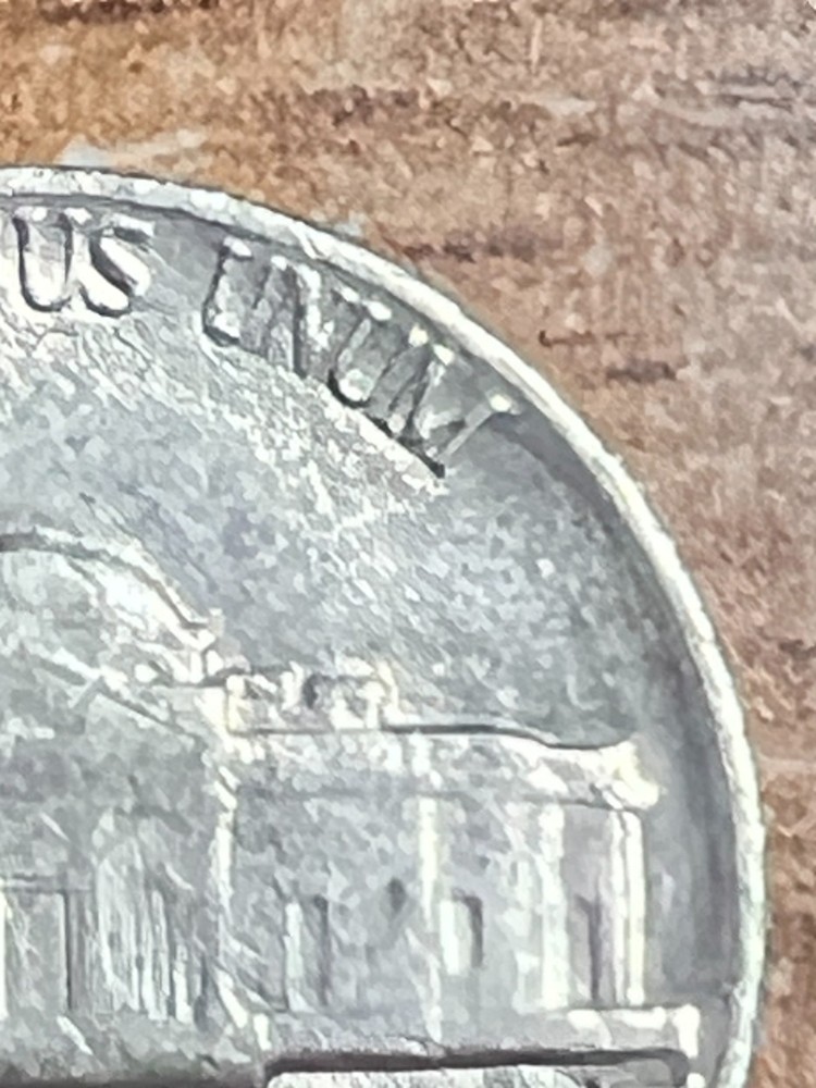 1982 ERROR JEFFERSON NICKEL STRUCK THROUGH AN OBJECT