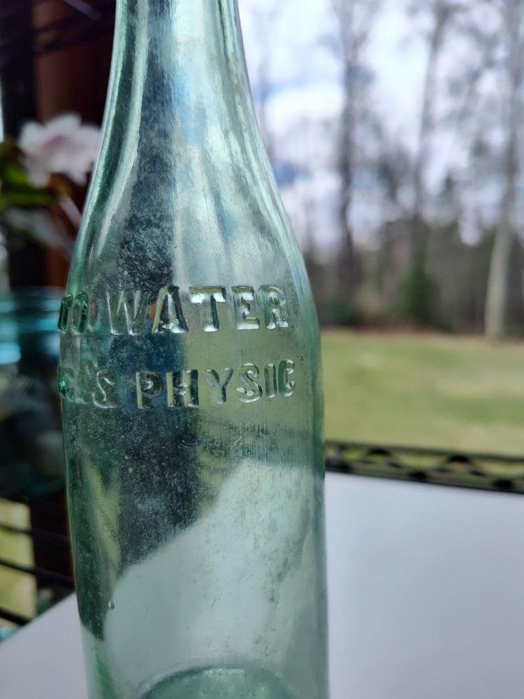 Vintage Pluto Water Bottle America’s Physic Devil Embossed Green
