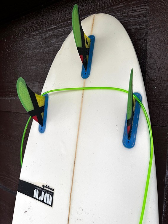 YANCER Surfboard and a cover