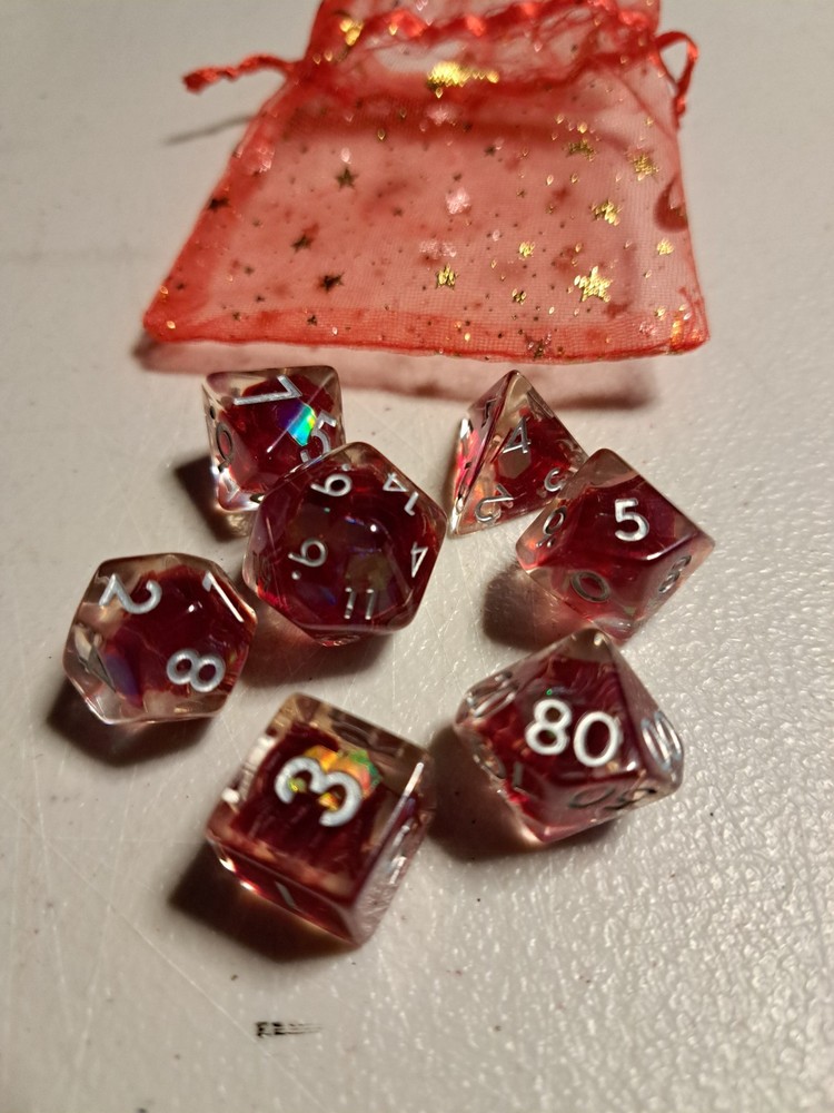 7 Peice Acrylic Dice. Clear Red with White Numbers