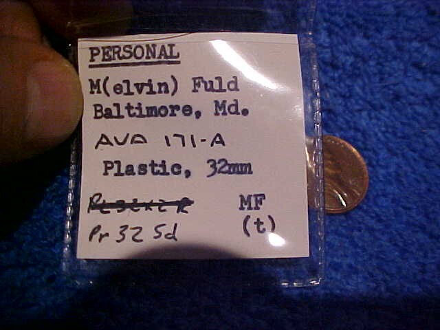 M. Fuld Baltimore Md Collector plastic token Red