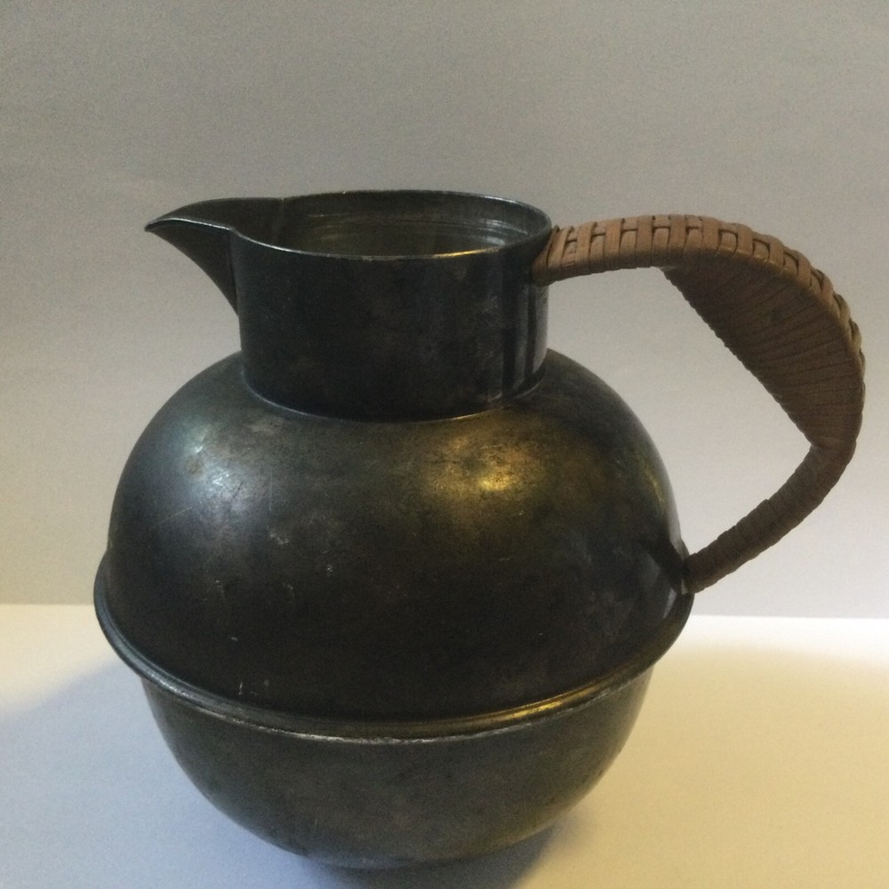vintage silver plated pitcher with rattan handle