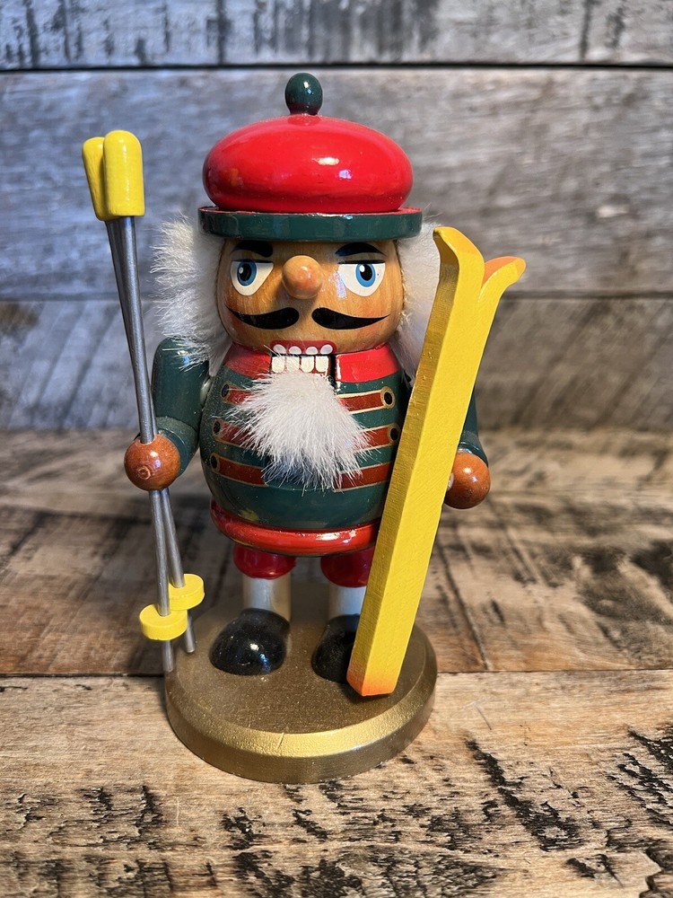 Vintage Christmas Nutcracker Holding Skies